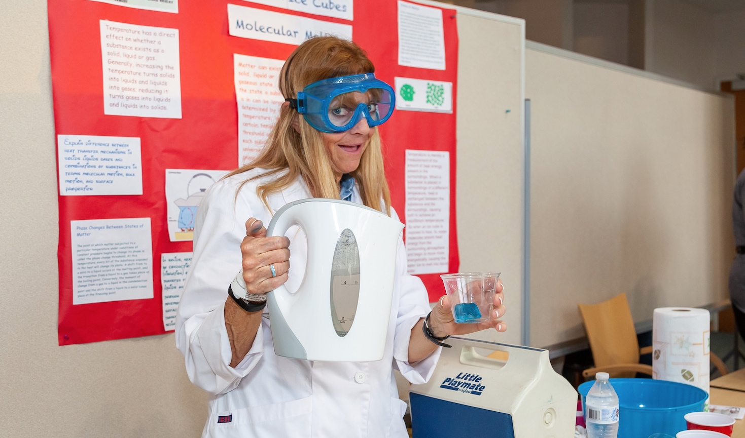 A teacher uses an hot water kettle and gelatin for a science demo