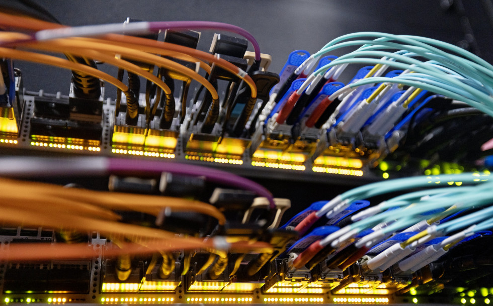 Photographed from the back-side are cables from the High Performance Computing (HPC) nodes for the Lattice Quantum Chromodynamics (LQCD) project in the Data Center at Jefferson Lab