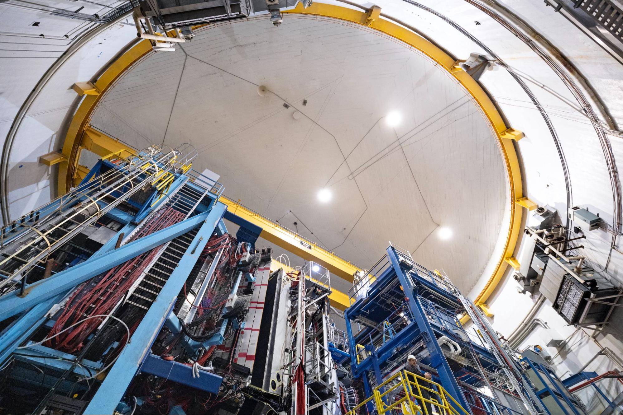 A view of the dome-shaped ceiling above metal frames supporting a particle detector inside Experimental Hall B at Jefferson Lab.