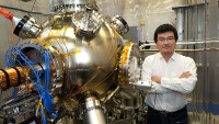 Erdong Wang with the high-voltage polarized electron gun